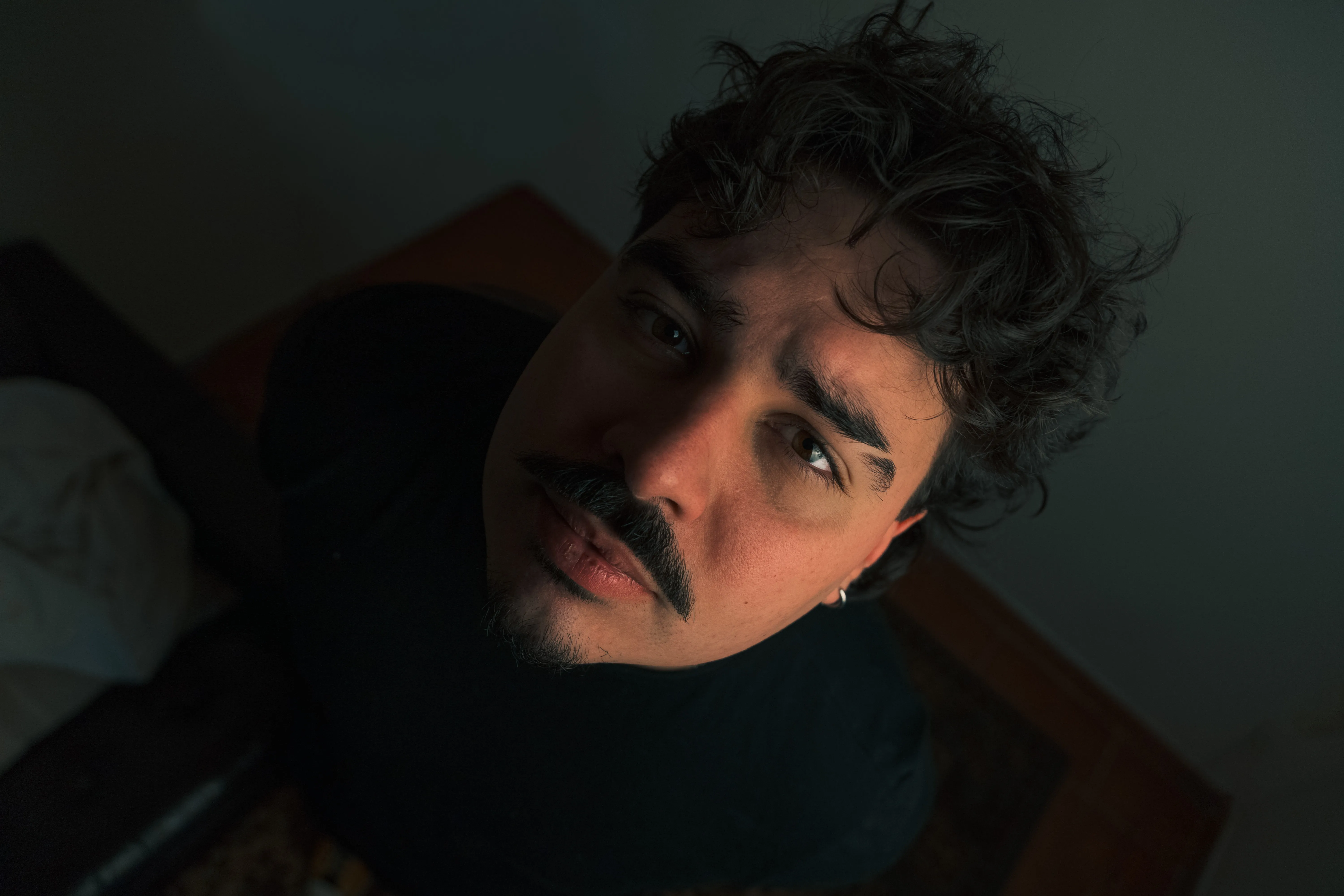 Daniel, looking away, contemplative atmosphere